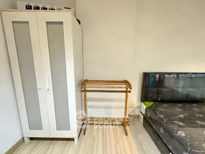 Cozy bedroom with wardrobe and bed in modern apartment