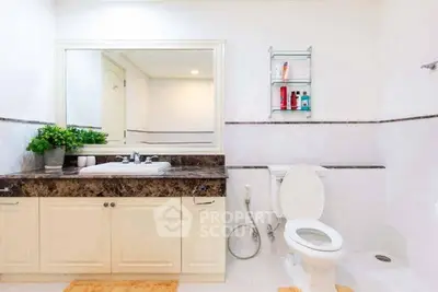 Spacious modern bathroom with elegant marble countertop and sleek fixtures