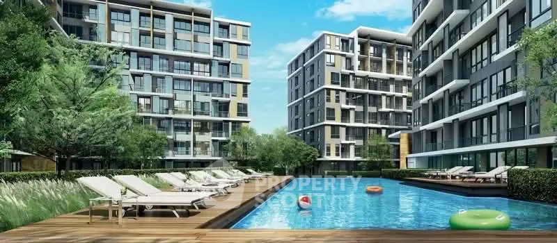 Luxurious modern apartment complex with a stunning outdoor pool and sun loungers, perfect for relaxation.