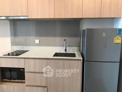 Modern kitchen with sleek cabinetry and stainless steel appliances