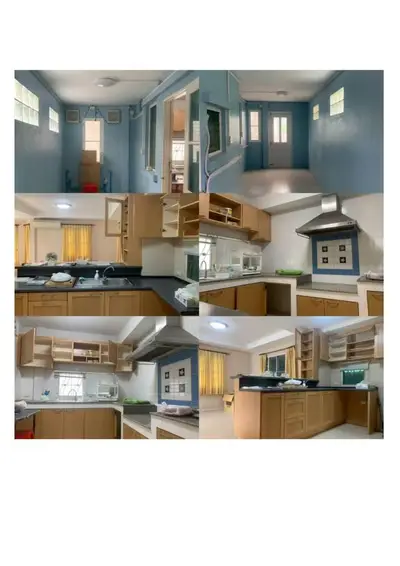 Spacious kitchen with modern cabinetry and ample natural light, perfect for culinary enthusiasts.