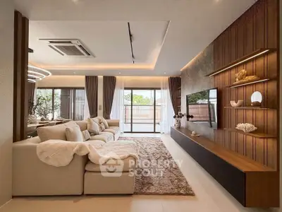 Luxurious living room with modern decor, spacious seating, and large windows offering natural light.