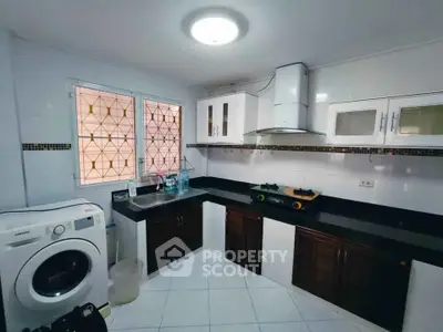 Spacious kitchen with modern appliances and ample storage space