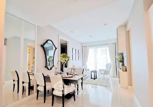 Elegant dining area with mirror and natural light in modern home