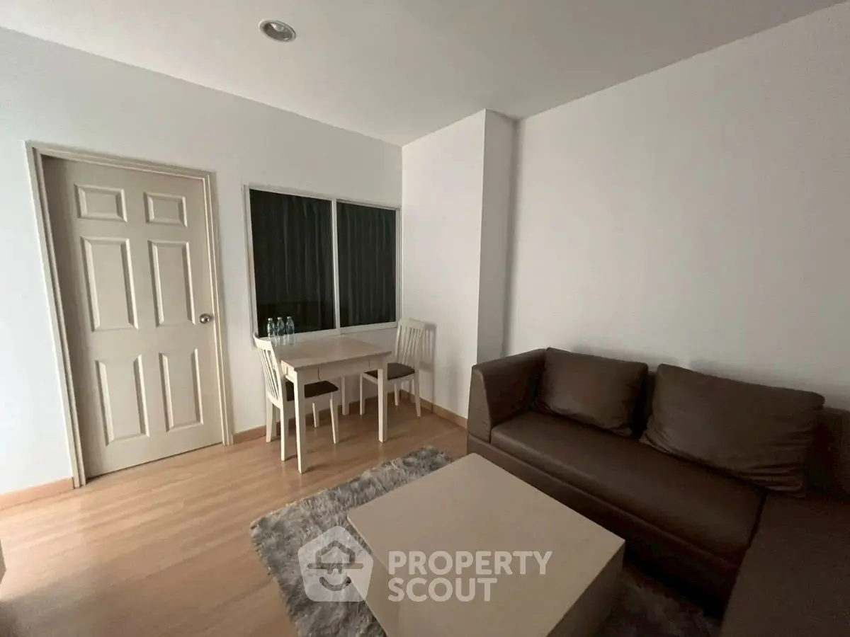 Cozy living room with modern furniture and dining area