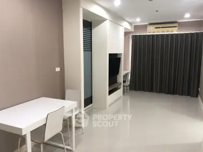 Modern living room with sleek furniture and air conditioning