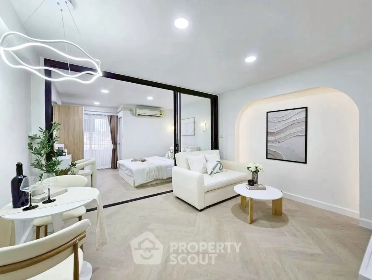 Modern open-plan living room with elegant decor and cozy ambiance