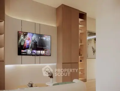 Modern living room with wall-mounted TV and stylish shelving