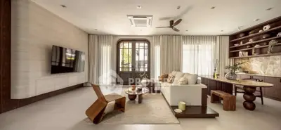 Luxurious modern living room with elegant furniture and open kitchen layout, perfect for stylish living.