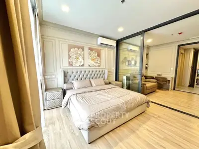 Luxurious bedroom with elegant decor and wooden flooring in modern apartment