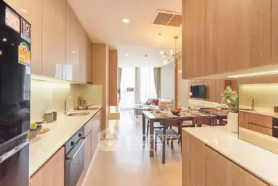 Spacious modern kitchen with open layout and dining area in luxury apartment