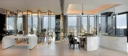 Luxurious modern living room with panoramic city views and elegant furnishings.