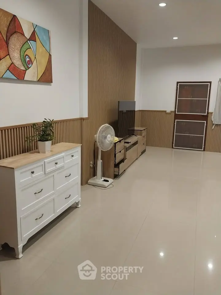 Spacious modern living room with stylish decor and sleek furniture