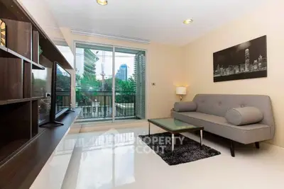 Modern living room with sleek furniture and city view balcony, perfect for urban living.