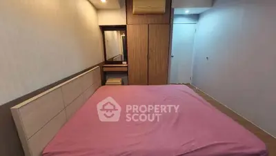Cozy bedroom with built-in wardrobe and air conditioning, perfect for restful nights.