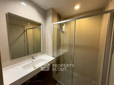 Modern bathroom with sleek shower and elegant vanity