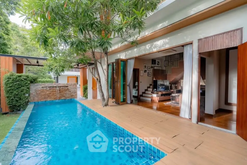 Luxurious villa with private pool and open living area, perfect for relaxation and entertaining.