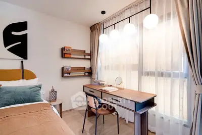 Modern bedroom with stylish desk and large window, perfect for work and relaxation.