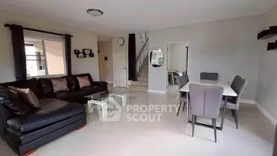 Spacious living and dining area with modern furniture and elegant decor