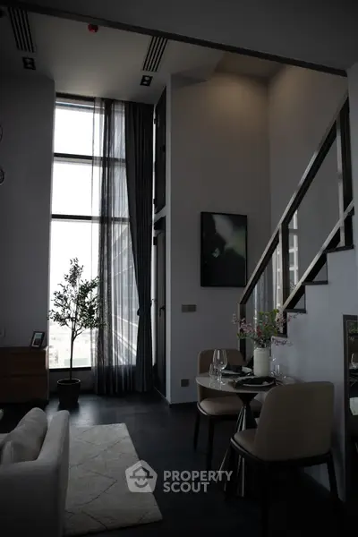 Luxurious modern living room with high ceilings and elegant decor