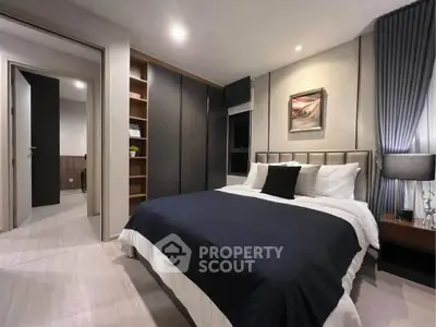 Modern bedroom with elegant decor and ample storage space