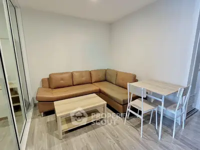 Modern living room with brown leather sectional sofa and wooden dining set