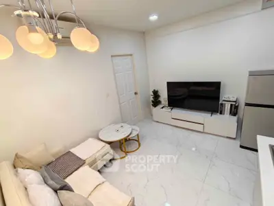 Modern living room with elegant lighting and sleek TV setup