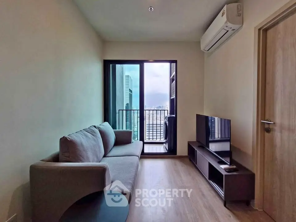 Modern living room with balcony view in high-rise apartment