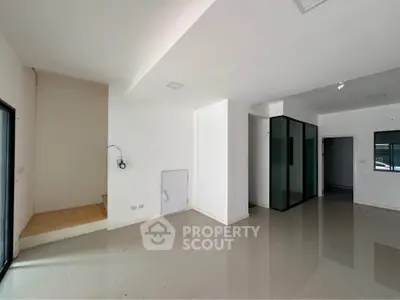 Spacious modern interior with sleek flooring and minimalist design, perfect for customization.