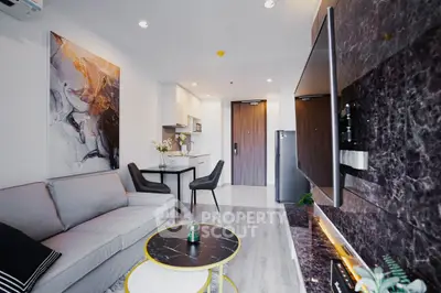 Modern living room with stylish decor and open kitchen layout