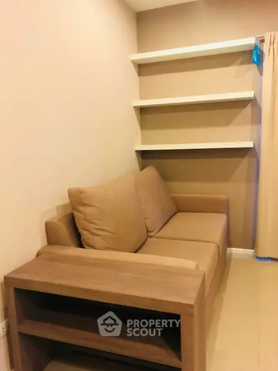 Cozy living room with beige sofa and modern wall shelves