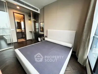 Modern bedroom with city view and ensuite bathroom in luxury apartment