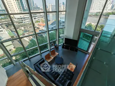 Stunning high-rise living room with floor-to-ceiling windows and breathtaking city views.
