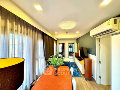 Stylish modern living room with dining area and air conditioning