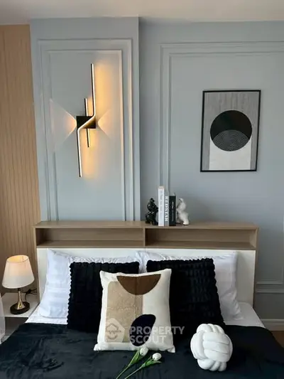 Modern bedroom with stylish decor and elegant lighting