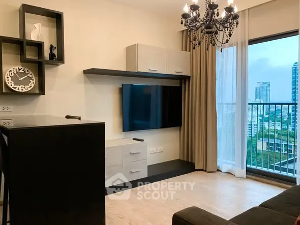 Modern living room with elegant chandelier and city view balcony