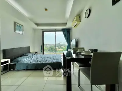 Modern studio apartment with sleek furnishings and a stunning view, perfect for urban living.