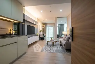 Modern open-plan living room with sleek kitchen and stylish decor
