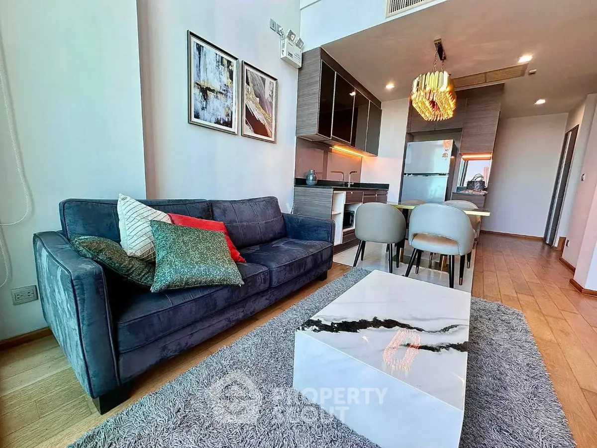 Modern living room with stylish decor and open kitchen layout