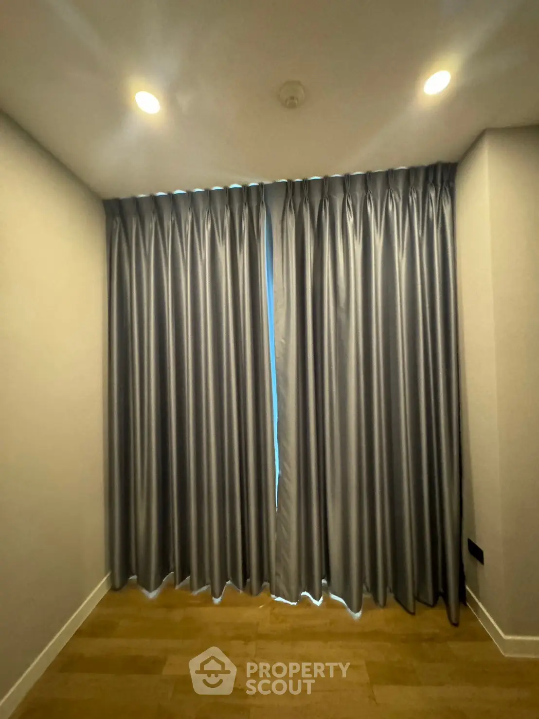 Elegant room with floor-to-ceiling curtains and warm lighting