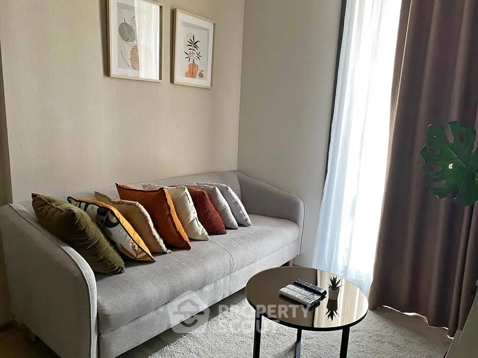Cozy living room with modern sofa and stylish decor, perfect for relaxation.