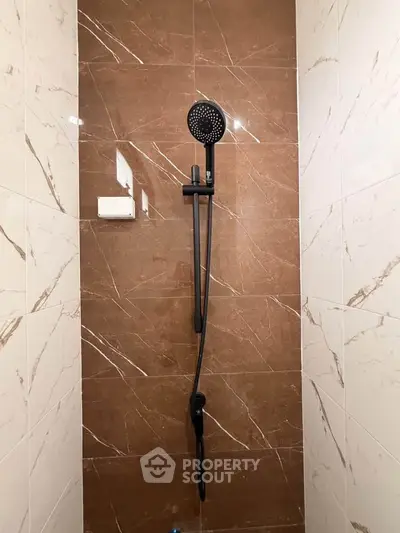 Modern bathroom shower with elegant brown and white tiles