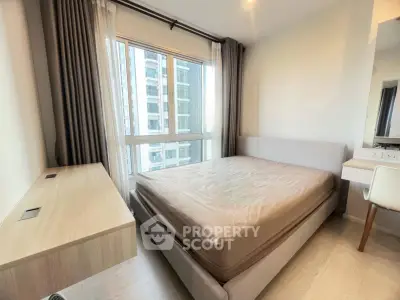 Modern bedroom with large window and stylish furniture in high-rise apartment