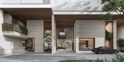 Luxurious modern building entrance with sleek design and elegant landscaping