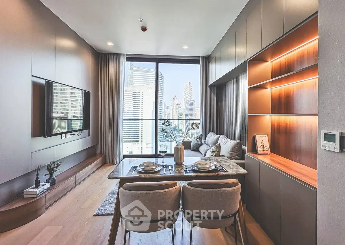 Modern living room with city view, sleek furniture, and built-in shelving.