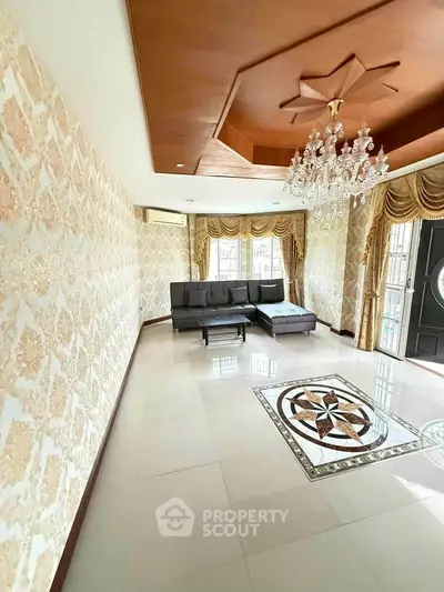 Luxurious living room with elegant chandelier and stylish decor
