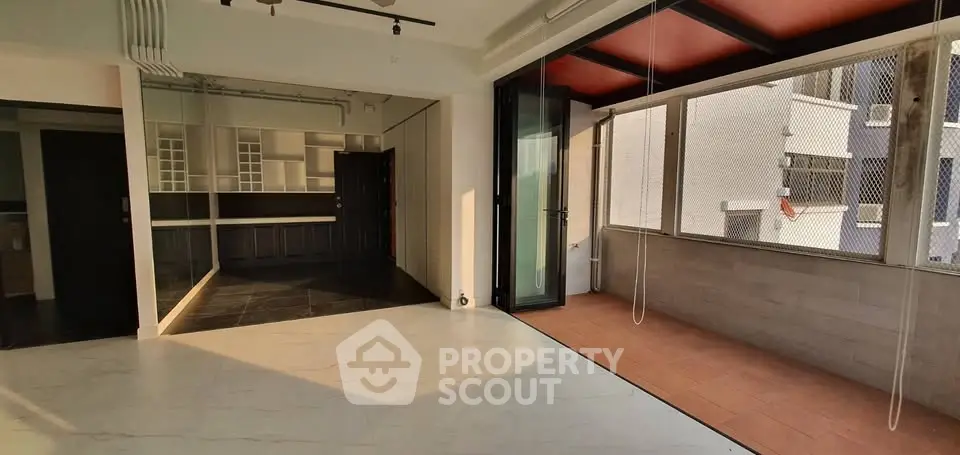 Spacious modern apartment with open layout and large balcony, perfect for urban living.