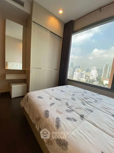 Modern bedroom with city view and large window in high-rise apartment