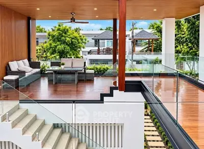 Luxurious modern balcony with stylish seating and stunning view, perfect for relaxation and entertainment.