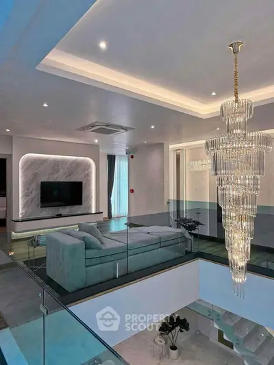 Luxurious modern living room with elegant chandelier and stylish decor